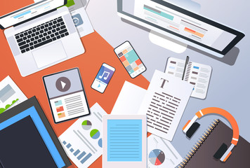 digital content management information technology concept top angle view desktop computer tablet laptop smartphone article text document office stuff horizontal © mast3r