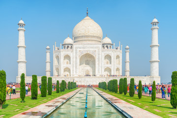 Fototapeta na wymiar Main view of the Taj Mahal on blue sky background