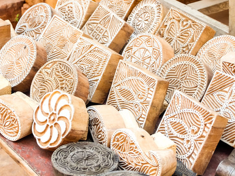 Wooden stamps printing blocks hand carved by artisans on the street market in Jaisalmer, India. Henna stamps for decorating the body or clothes.