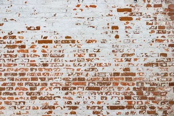 Papier Peint photo Mur de briques La texture du vieux mur de briques peint en blanc avec de la peinture écaillée