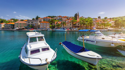 Fishing boats in Splitska village with beautiful port, Brac island, Croatia. Village of Splitska on...