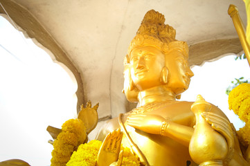 Hindu god Brahma gold shabby old statue in Thailand. Beautiful Indian religion traditional lord...