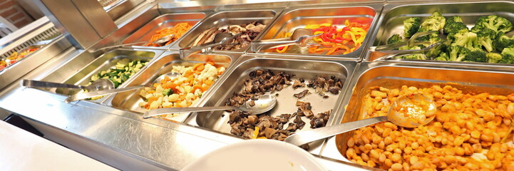 restaurant with many raw and cooked foods with many trays
