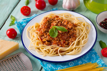 spaghetti bolognese on wooden surface