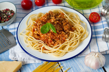 spaghetti bolognese on wooden surface