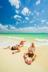 Fototapeta na wymiar Two Women enjoying their holidays on the tropical beach