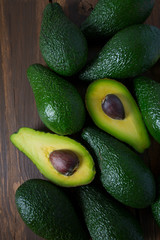 avocado on dark wooden surface