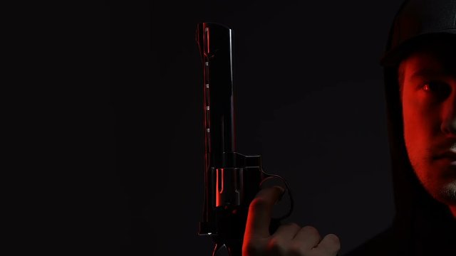 Killer threatening with gun half face background, statistics of criminal offense