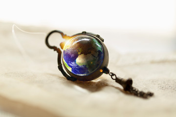 Abstract Background of Earth in Ancient watch. Elements of this image furnished by NASA.