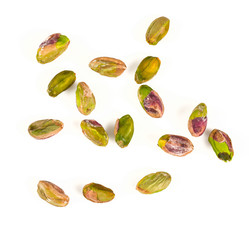 peeled pistachio nuts isolated on white