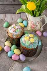 Easter cake, painted eggs on a wooden background.