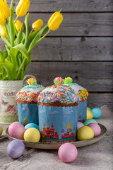 Easter cake, painted eggs on a wooden background.