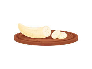 Banana on cutting board on white background.