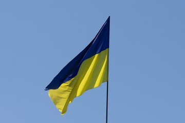 Flag ukraine on europe blue sky with wind,  color.