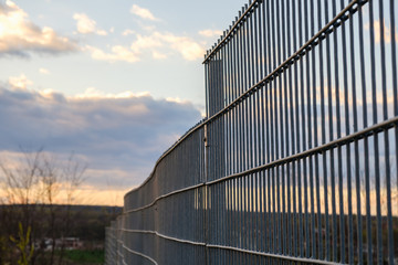 Metal fence wire, painted in blue color.
