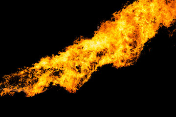 Flames caused by the explosion of the oil isolated on black background. Demonstration of water on...