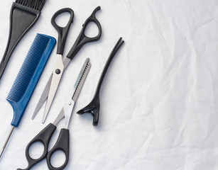 flat composition with professional hairdressing tools on white background, with copy space
