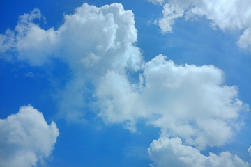 Naklejka na ściany i meble Puffy Cloud on the blue sky background.