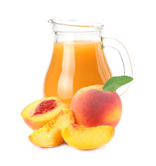 jug of peach juice with peach fruit and slices isolated on white background.