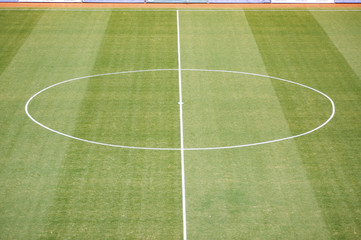 Aerial view of natural beautiful pattern of fresh green grass soccer field background. Football stadium.