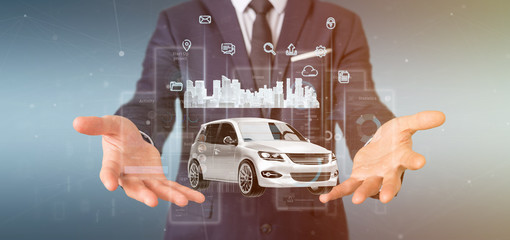 Businessman holding Dashboard smartcar interface with multimedia icon and city map on a background 3d rendering