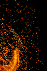 flame of fire with sparks on a black background