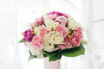 Bouquet of white, purple and pink peonies