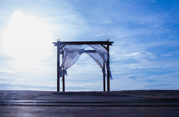 Beautiful and Romatic wedding arch tent on the beach by the sea
