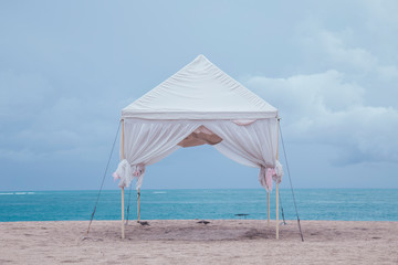 Fototapeta na wymiar Beautiful and Romatic wedding arch tent on the beach by the sea