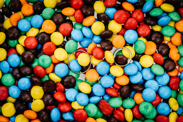 Wedding Rings on a Multicolored Sweets