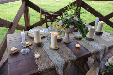 wooden table set with candles