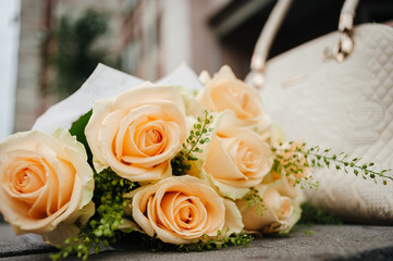 bouquet of pale yellow roses on the background of the bag