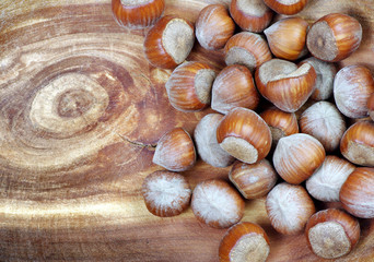 hazelnuts on wooden background. top view. close up