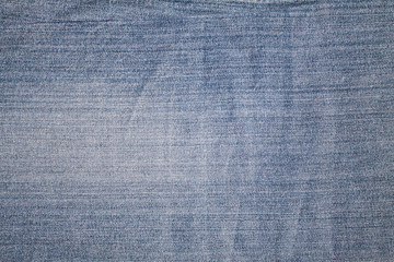 Texture of blue jeans textile close up