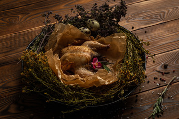 Mongolian chicken with herbs on wooden background