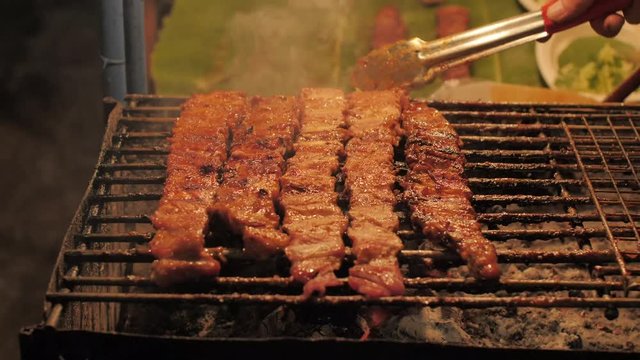 Thail style BBQ Street food market / people walking street food market in Thailand