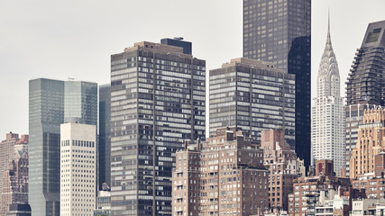 Fototapeta na wymiar Manhattan skyline seen from the Roosevelt Island, color toning applied, New York City, USA.