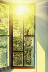 Vintage window with vivid sunlight passing through