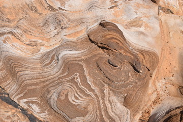 drone shot texture of rocks in desert ressembling to a bear 