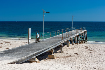 The iconic Normanville jetty with no people and blue skies on a bright sunny day on the Fleurieu Peninsula South Australia on 20th March 2019