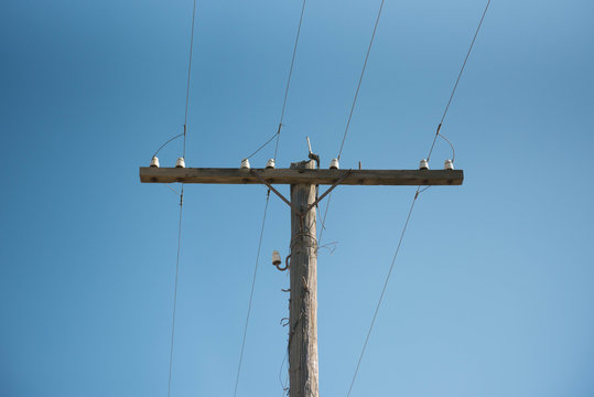 Wooden power pole  in the city