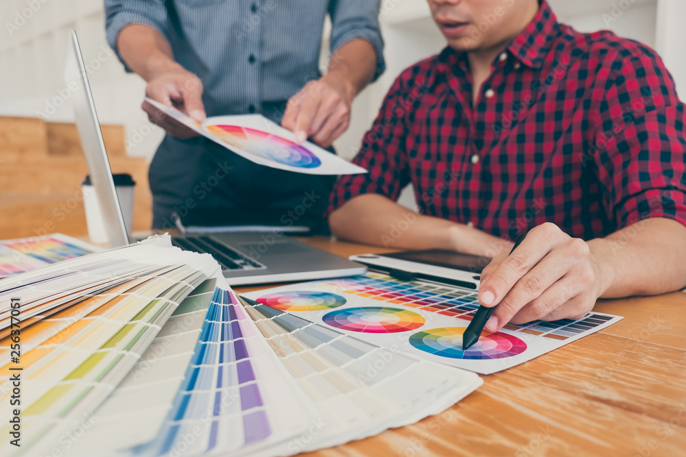 Poster teamwork of young creative designers working on project together and choose color swatch samples for
