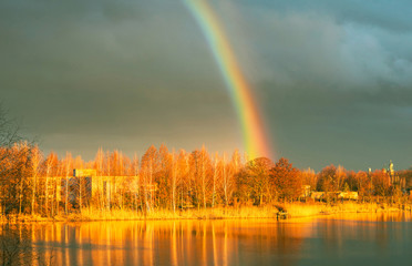 Golden magical landscape with rainbow 