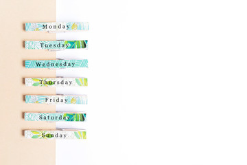 Wooden clips with seven days in a week. Sunday, Monday, Tuesday, Wednesday, Thursday, Friday,...