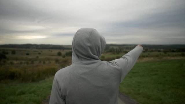 Men is looking on valley. Med shot, slow motion 50fps