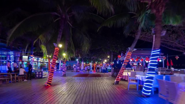 night illuminated sanya city dadonghai beach restaurant street walking panorama 4k timelapse hainan island china