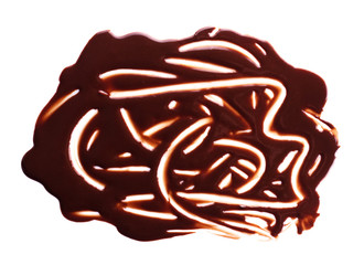 Chocolate drips. Melted chocolate on the surface, the patterns isolated on white