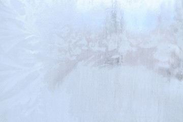 Naklejka na ściany i meble Frosty patterns on a frozen ice box in the early morning