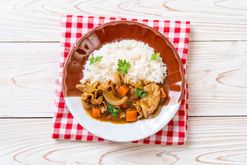 Japanese curry rice with sliced pork, carrot and onions