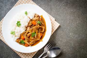 Japanese curry rice with sliced pork, carrot and onions